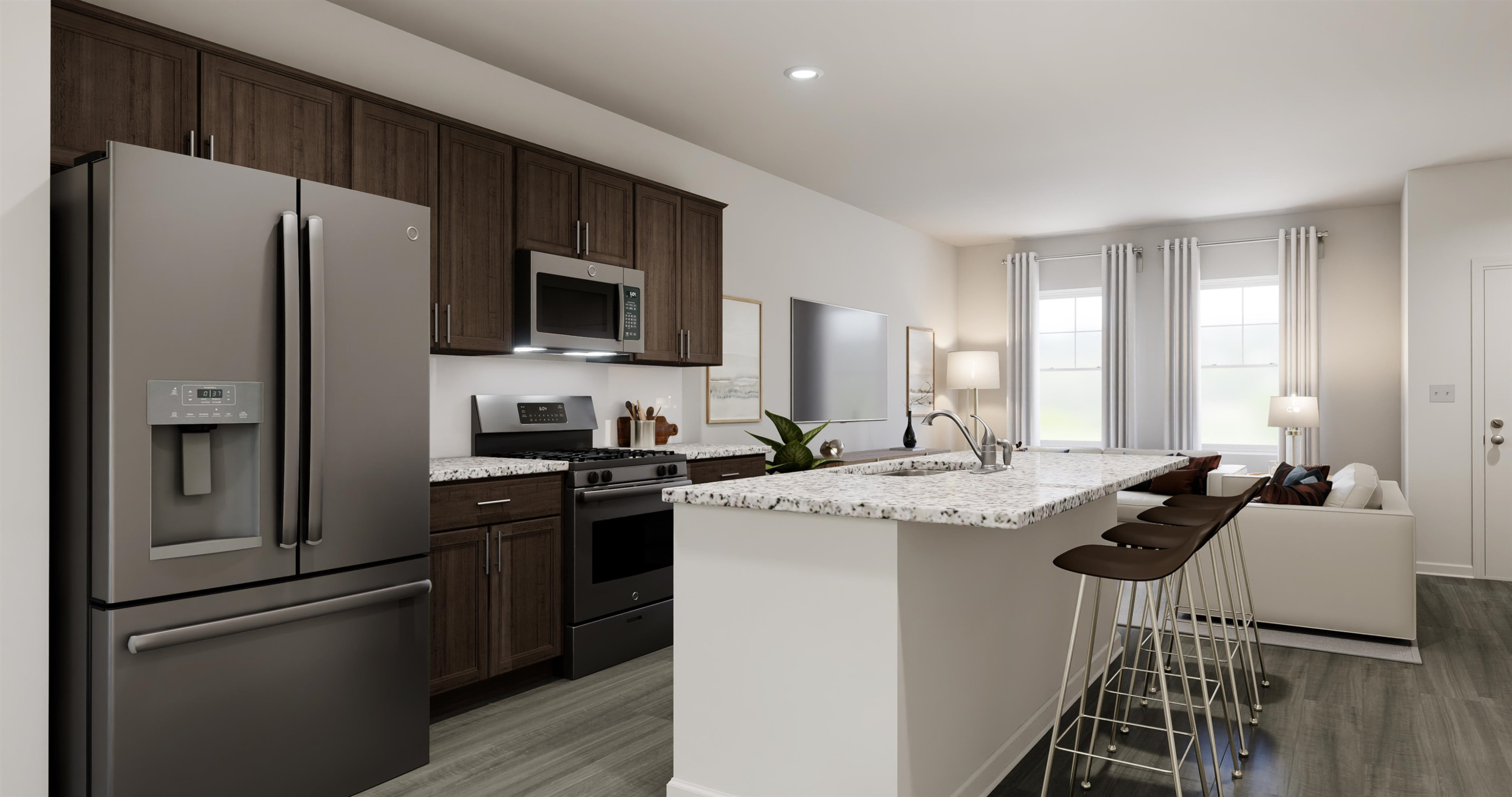 a kitchen with a refrigerator a stove and a sink