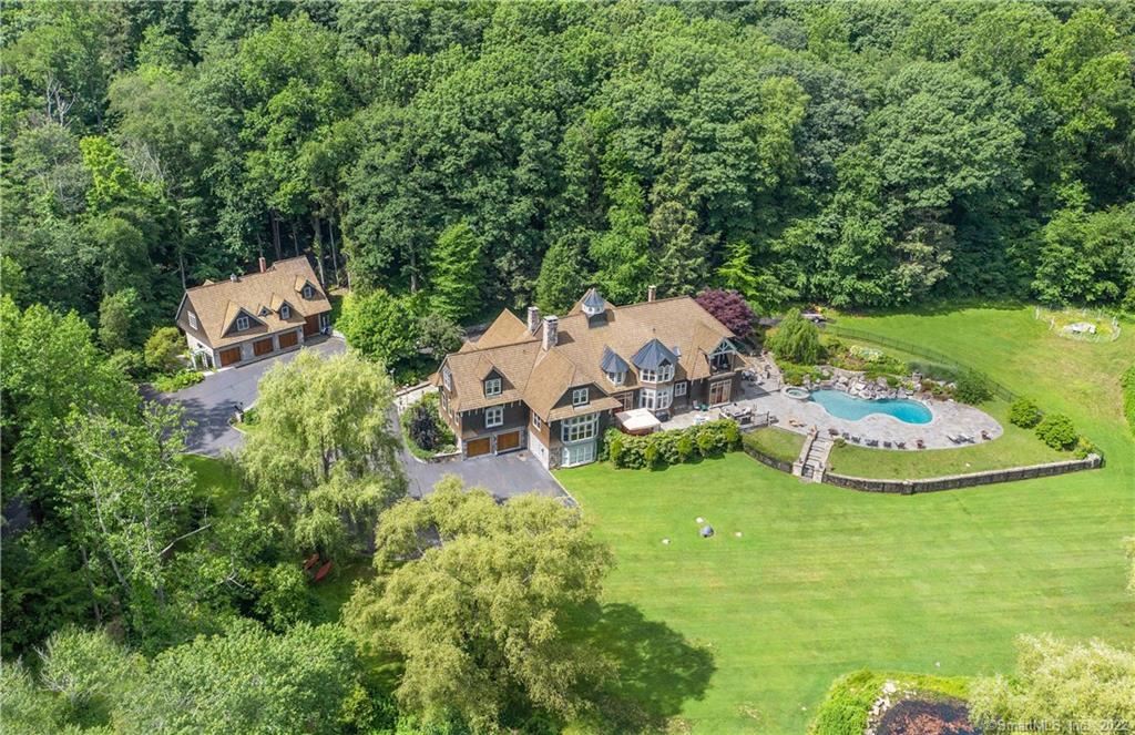 413 Branchville Road Ridgefield, CT 06877 - Photo 1 of 1 an aerial view of a house with garden space and trees all around