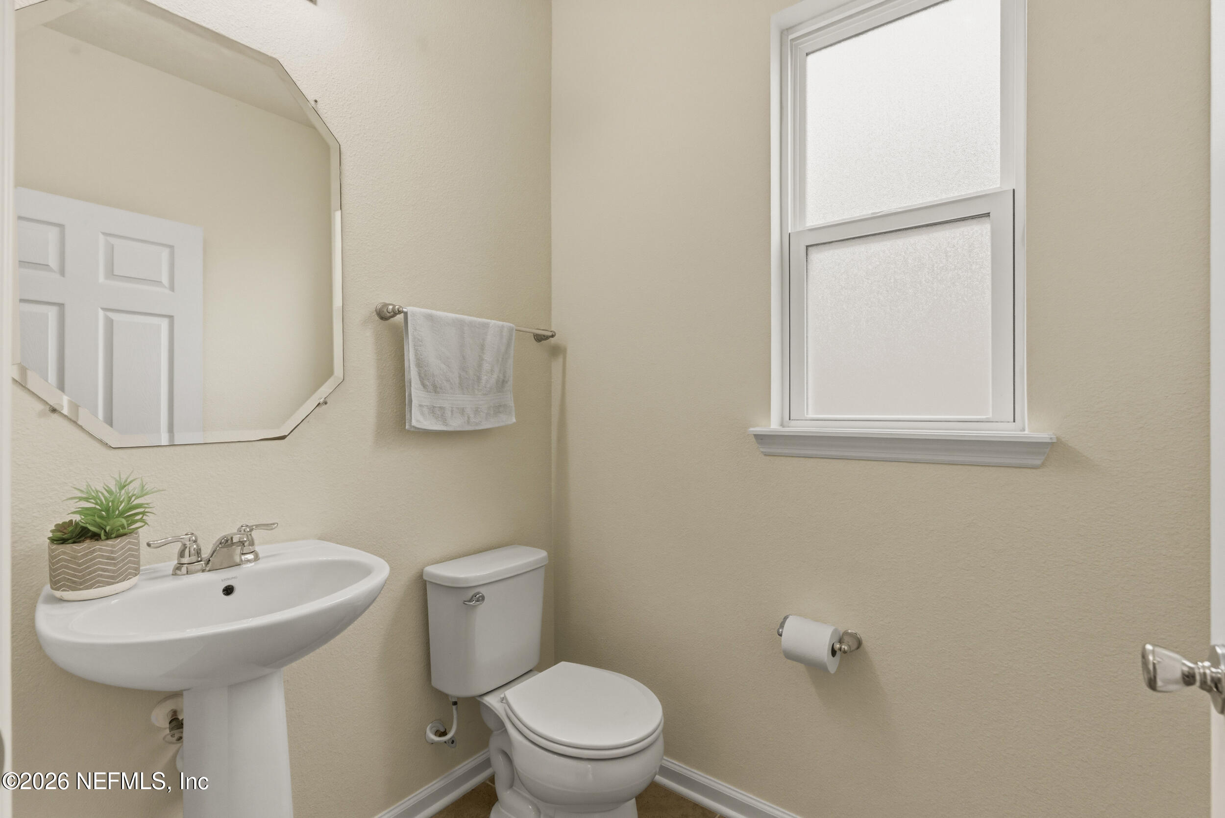 270 Carnation Street St. Johns, FL 32259 - Photo 20 of 56 a bathroom with a sink a toilet and mirror