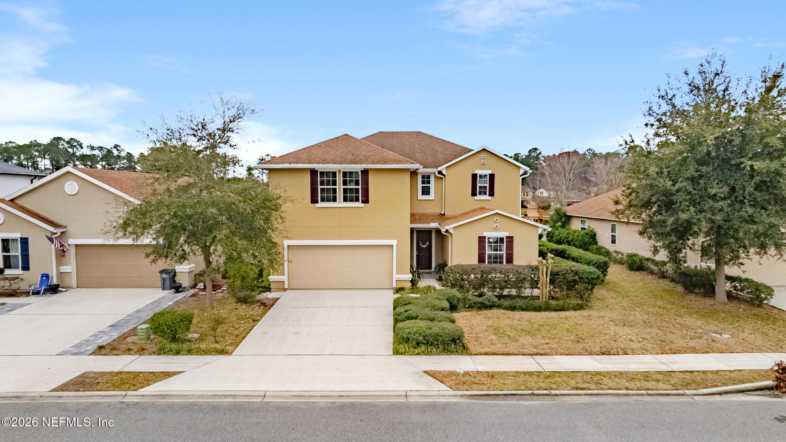 270 Carnation Street St. Johns, FL 32259 - Photo 2 of 56 a front view of a house with a garden