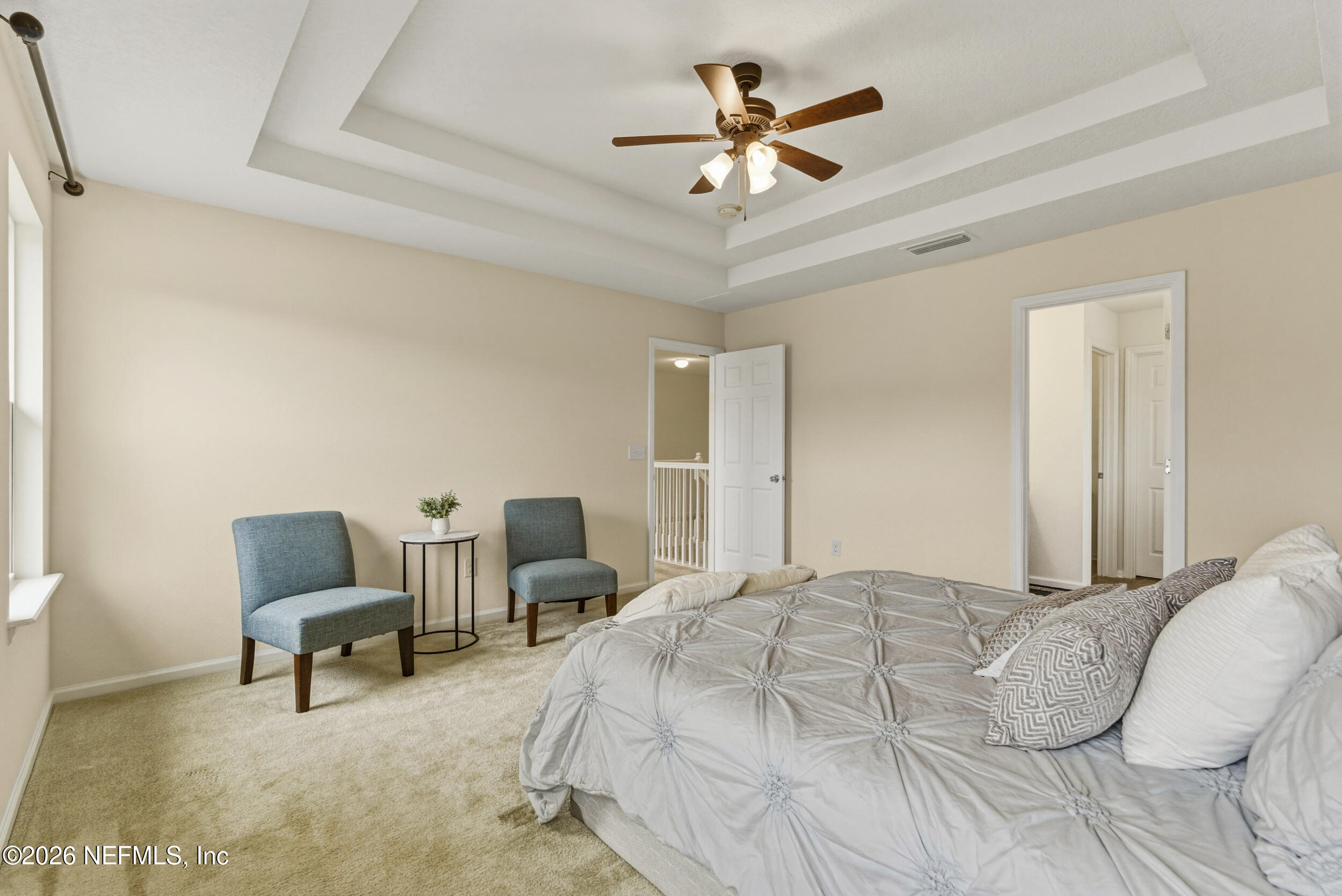 270 Carnation Street St. Johns, FL 32259 - Photo 27 of 56 a bedroom with a bed a chair and a couch