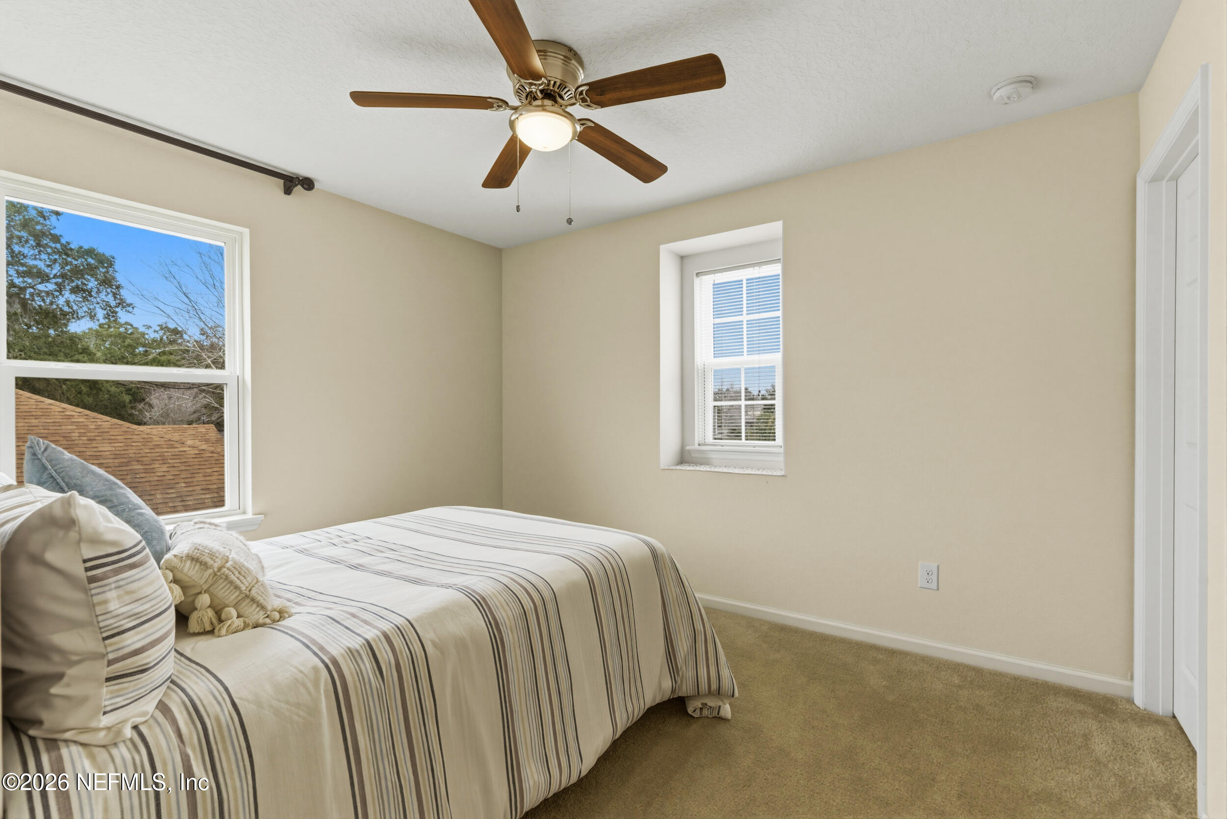 270 Carnation Street St. Johns, FL 32259 - Photo 31 of 56 a bedroom with a bed and a window