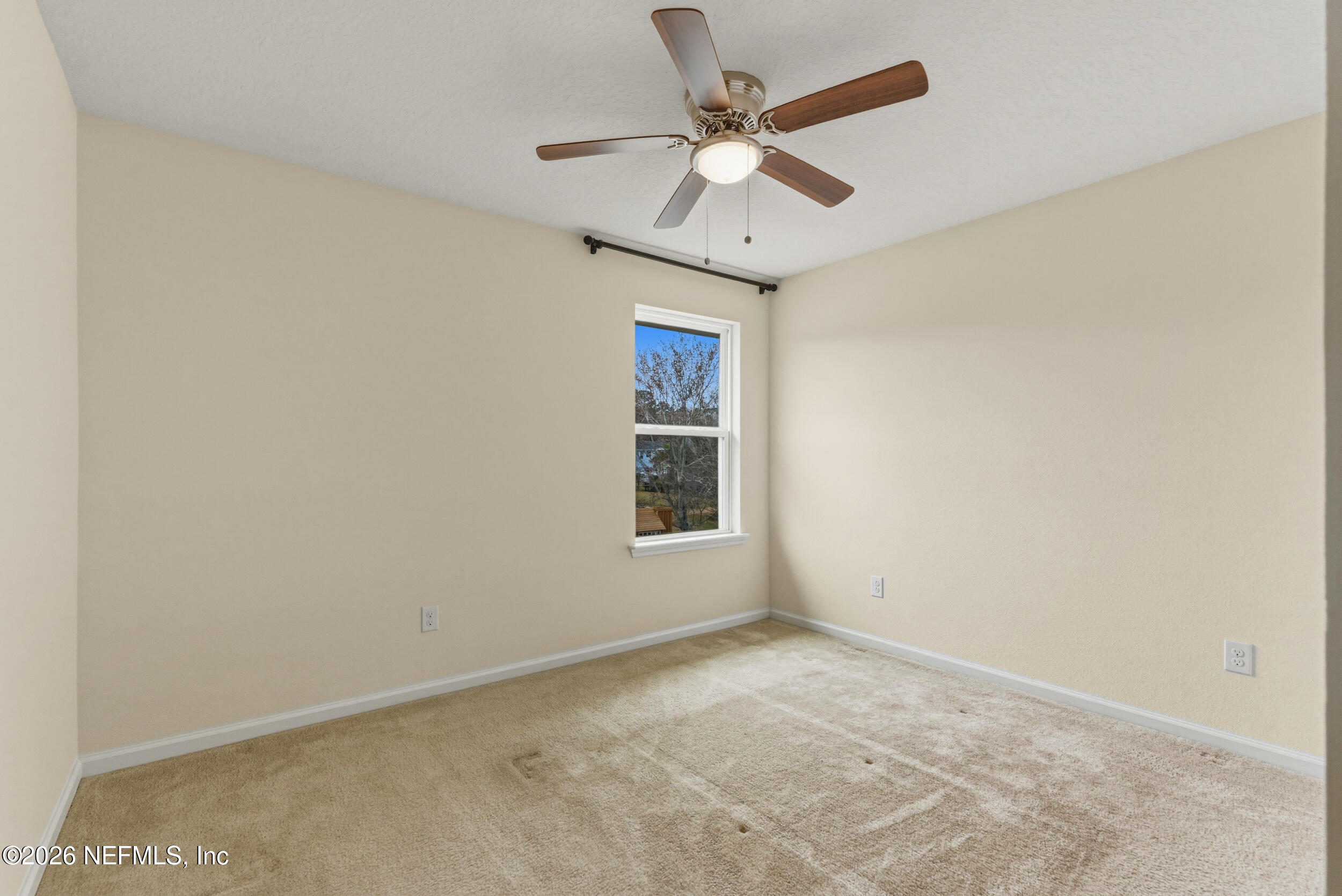 270 Carnation Street St. Johns, FL 32259 - Photo 35 of 56 an empty room with a window and a fan