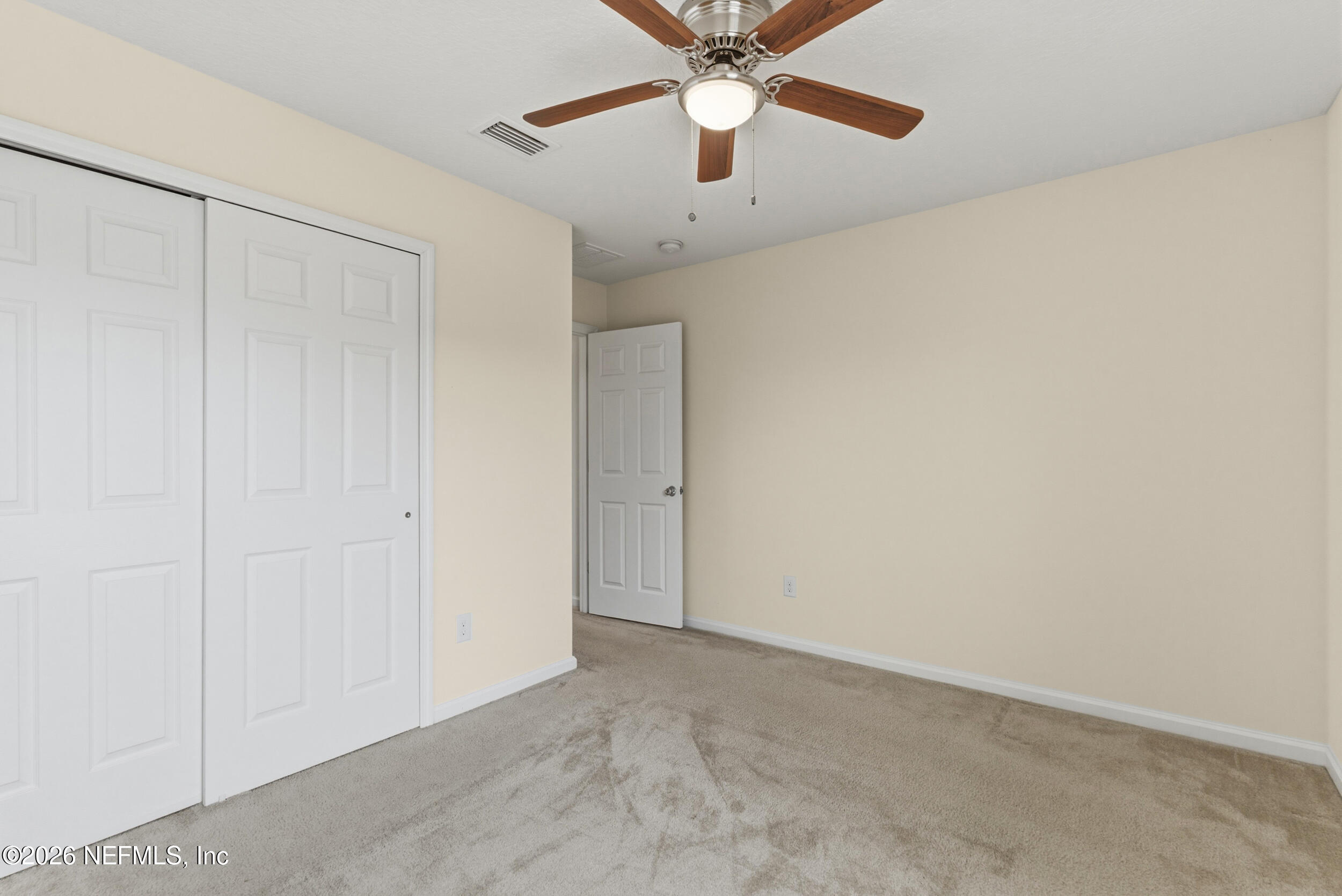 270 Carnation Street St. Johns, FL 32259 - Photo 37 of 56 an empty room with a chandelier fan