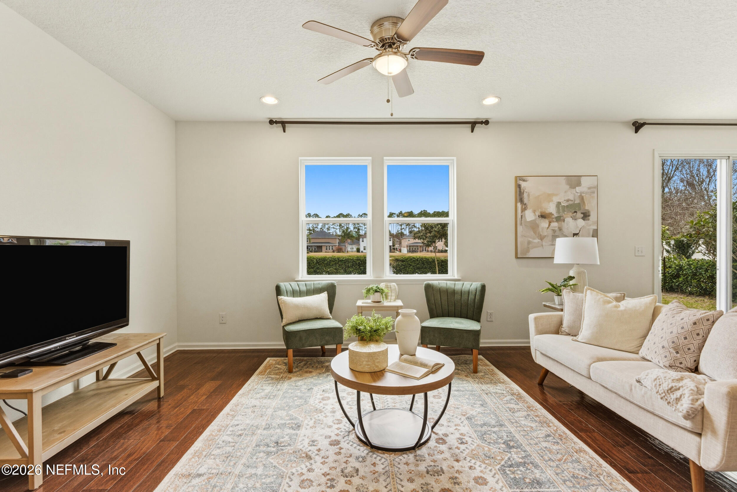 270 Carnation Street St. Johns, FL 32259 - Photo 7 of 56 a living room with furniture and a flat screen tv