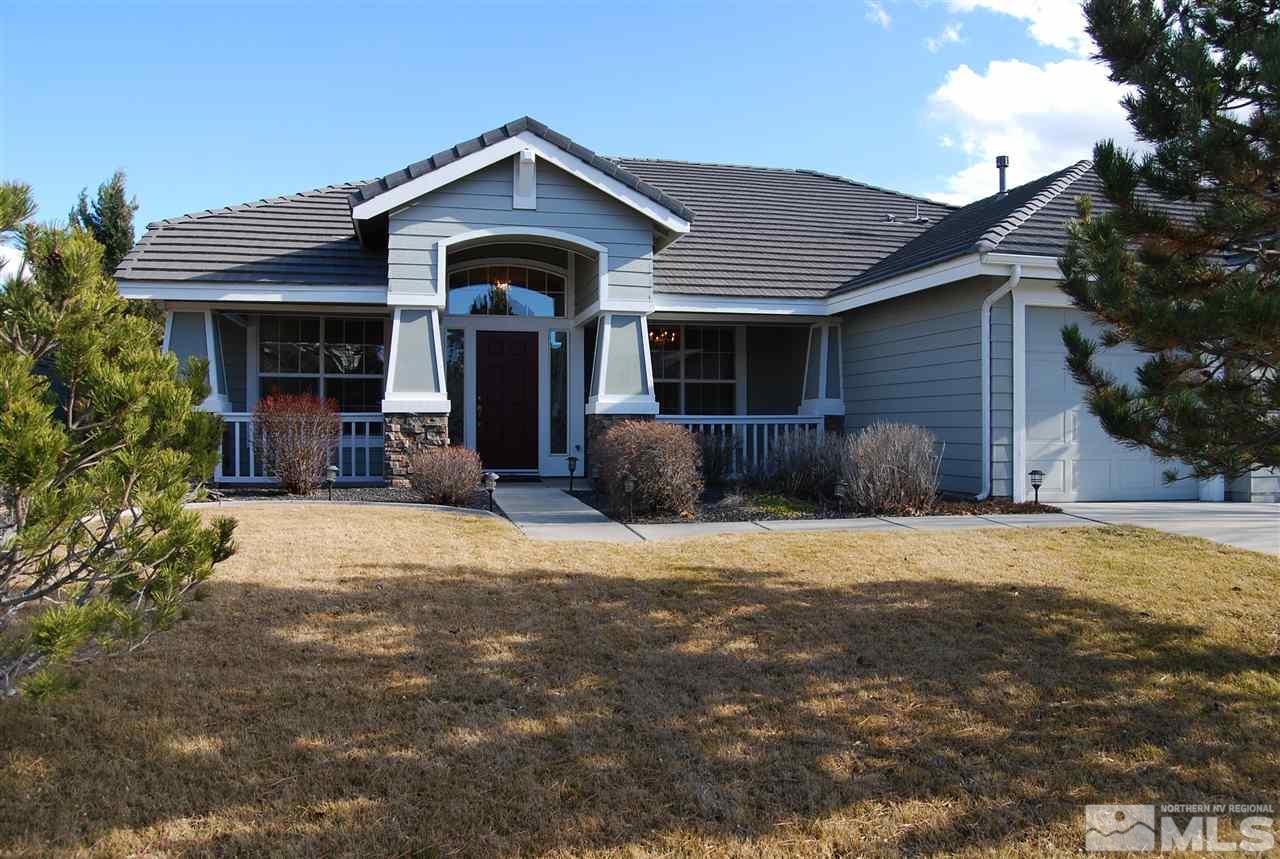 9942 Rio Bravo Drive Reno, NV 89521 - Photo 1 of 1 a front view of a house with a yard