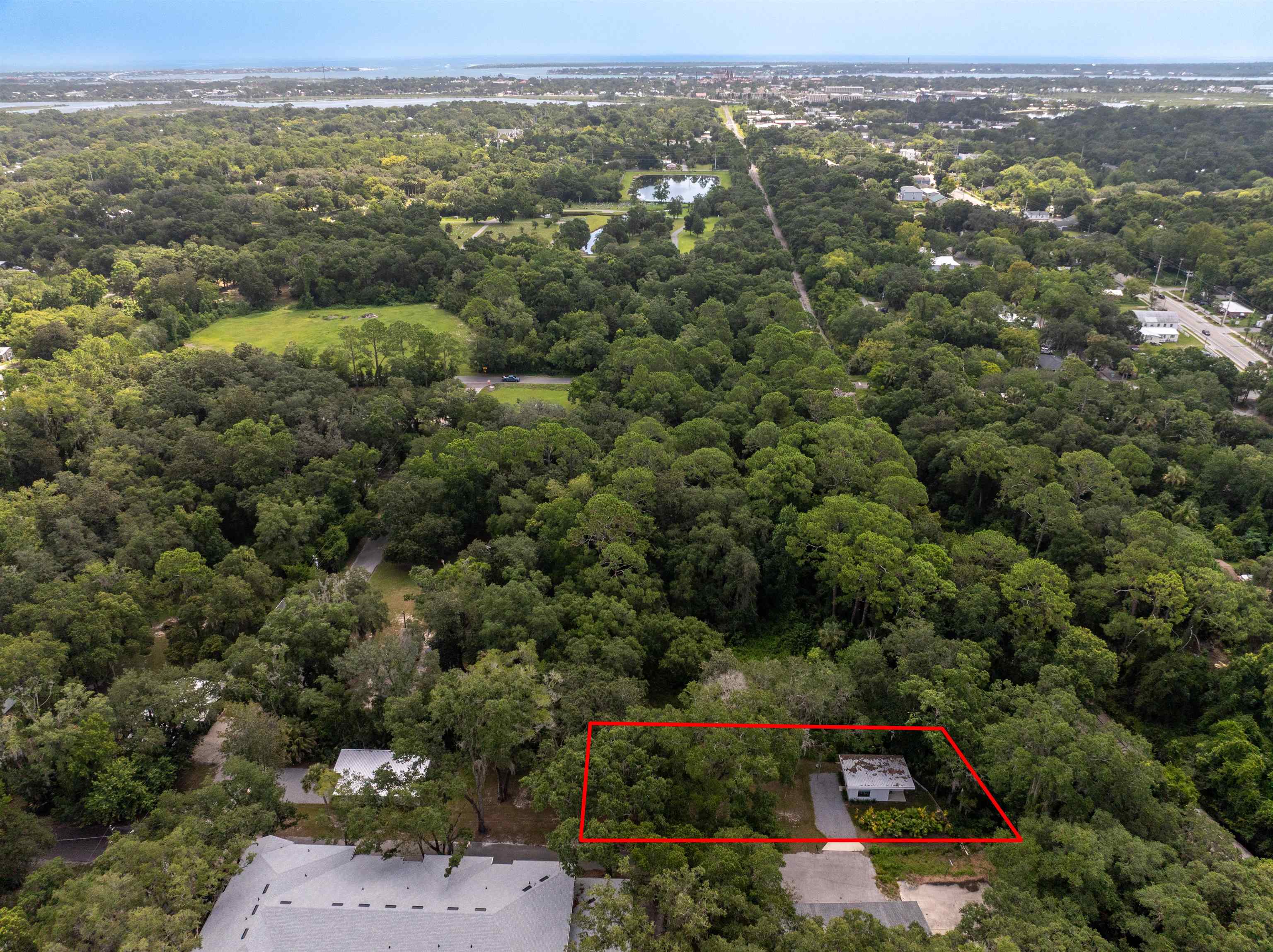 156 North St Johns Street St. Augustine, FL 32084 - Photo 14 of 14 an aerial view of residential house with parking and trees