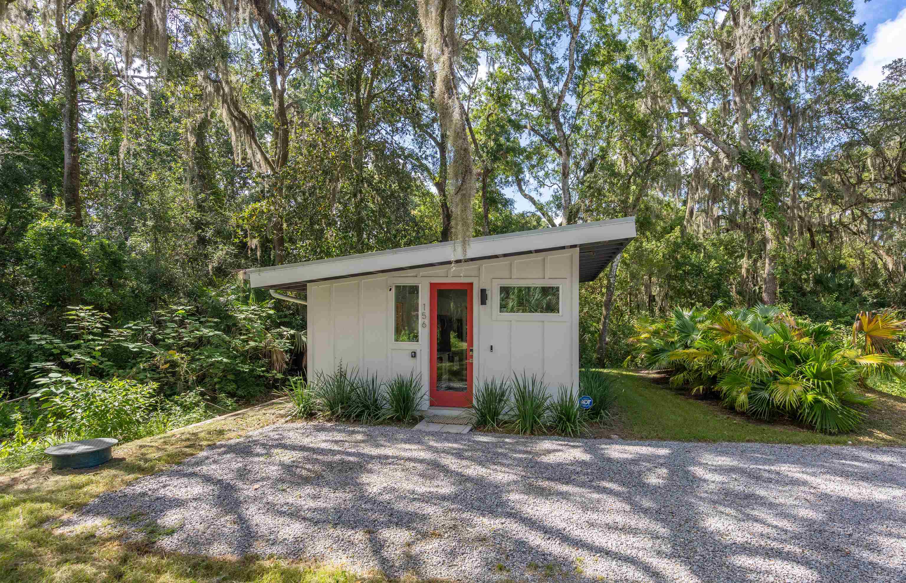 156 North St Johns Street St. Augustine, FL 32084 - Photo 3 of 14 a view of a house with a yard and large trees