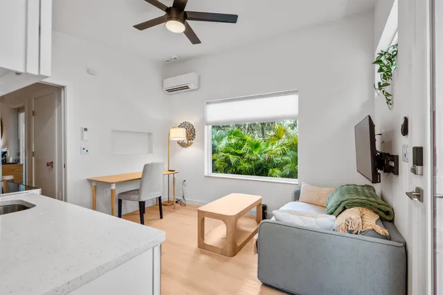 a living room with furniture and a window