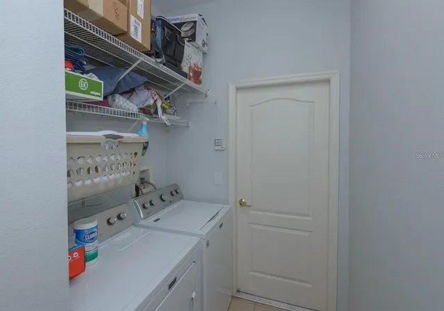 a utility room with dryer and washer