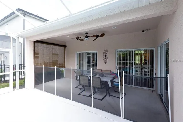 a room with lots of furniture and a chandelier