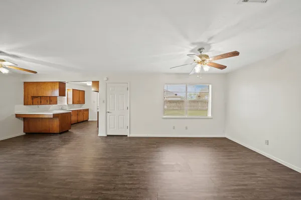 a view of an empty room with a window