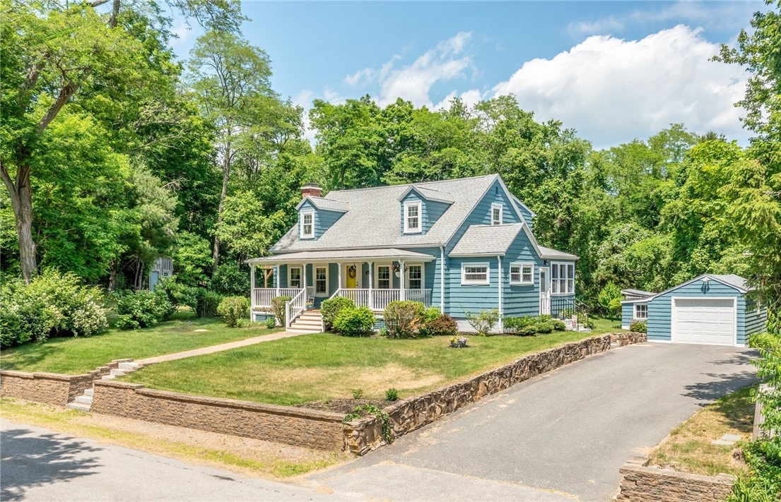 Exterior front with driveway and garage