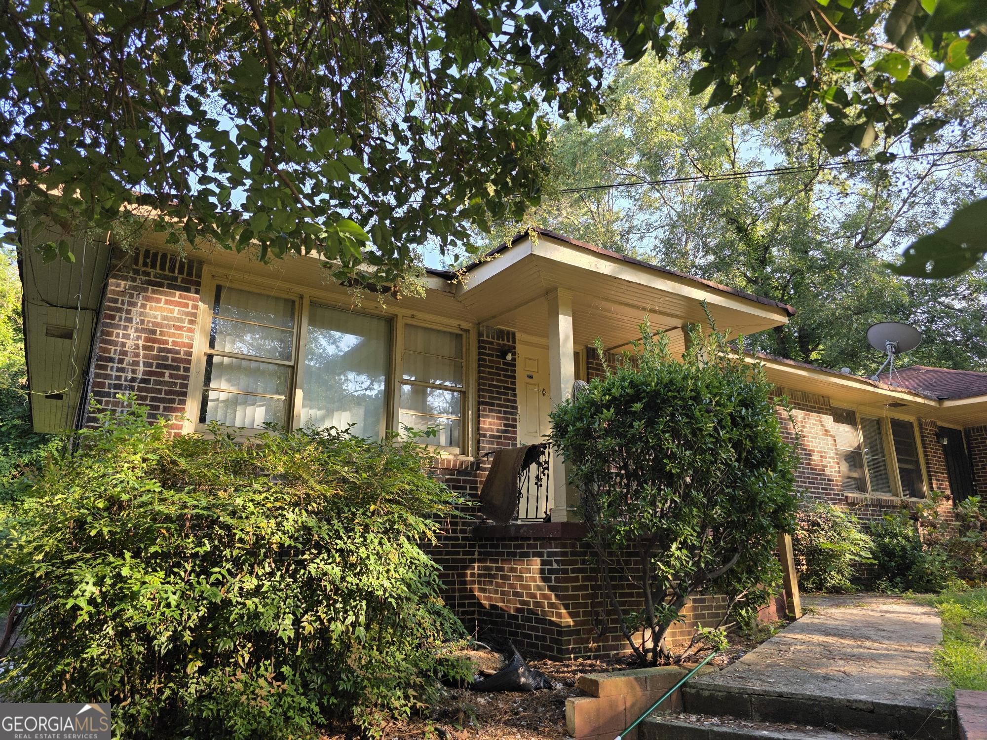 1172 Fayetteville Road Southeast, Unit A & B Atlanta, GA 30316 - Photo 3 of 10 a front view of a house with garden