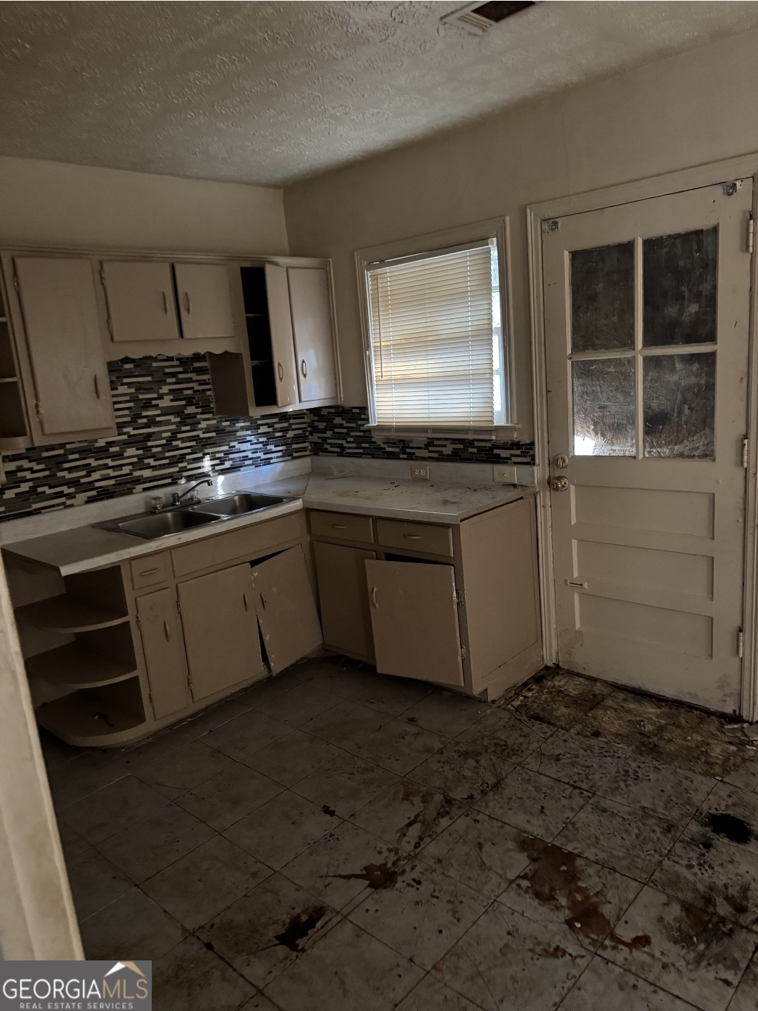 1172 Fayetteville Road Southeast, Unit A & B Atlanta, GA 30316 - Photo 10 of 10 a kitchen with stainless steel appliances a sink stove and cabinets