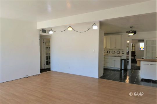 1263 Primrose Street Ridgecrest, CA 93555 - Photo 5 of 35 a view of a kitchen with a refrigerator
