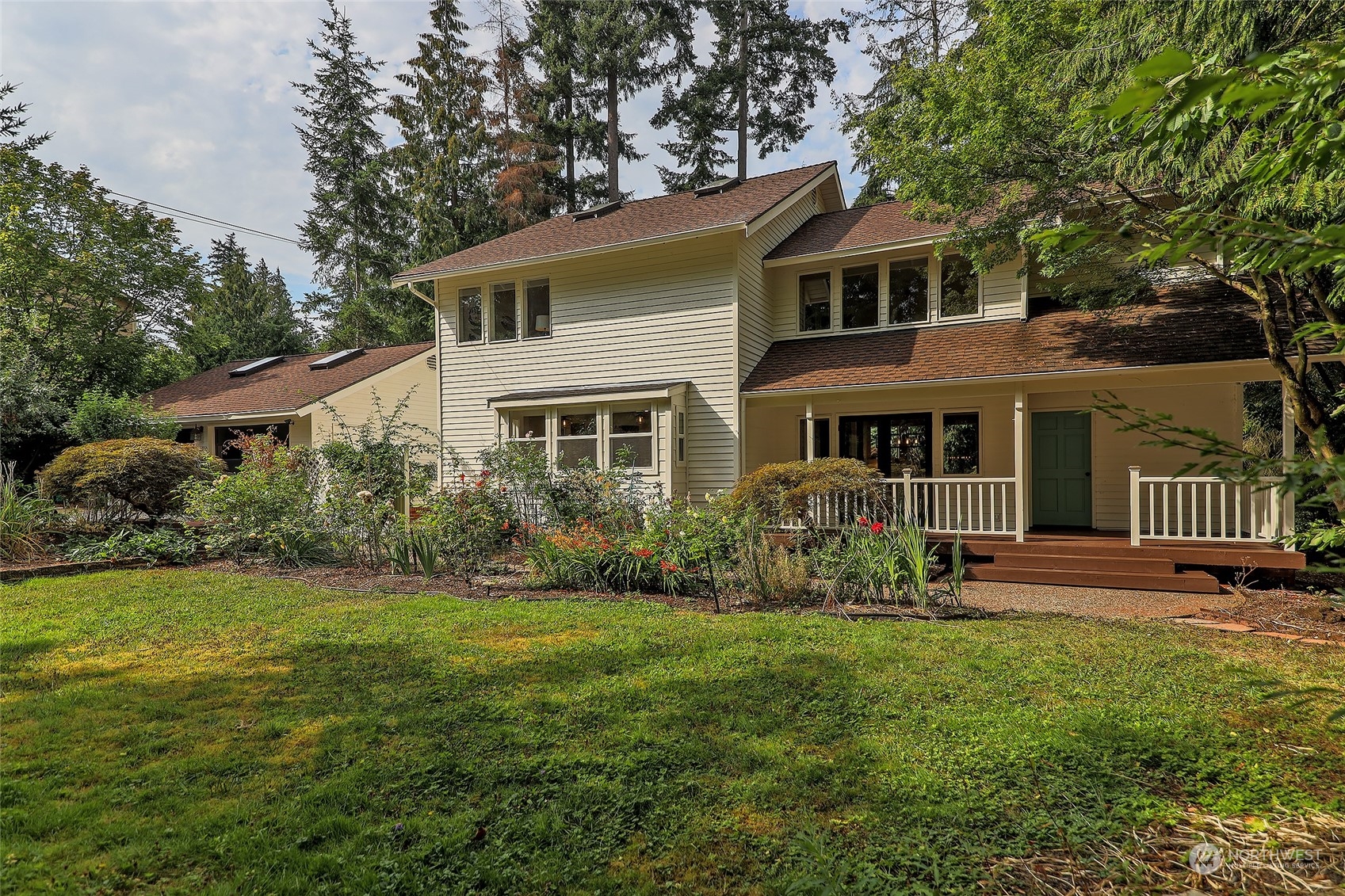 16910 3rd Avenue Southeast Bothell, WA 98012 - Photo 1 of 40 a front view of a house with garden and porch