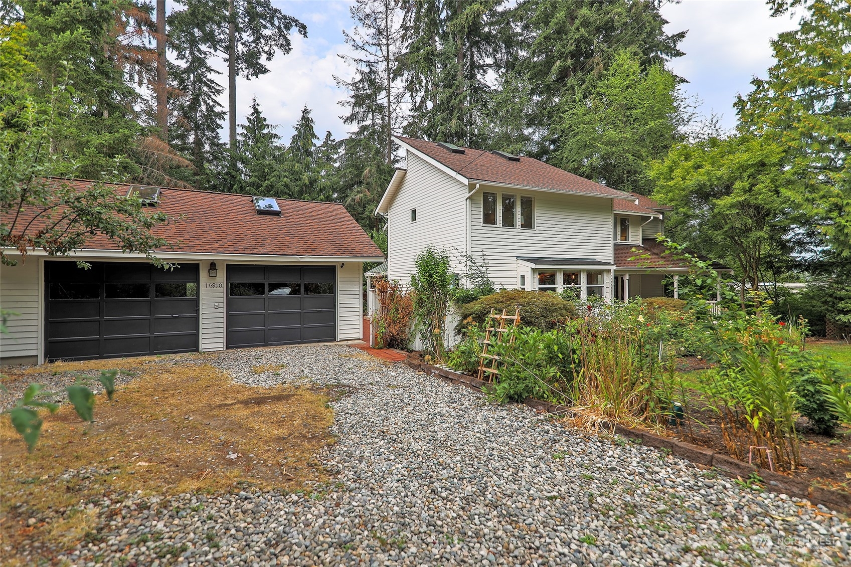 16910 3rd Avenue Southeast Bothell, WA 98012 - Photo 2 of 40 a front view of a house with a yard and garage