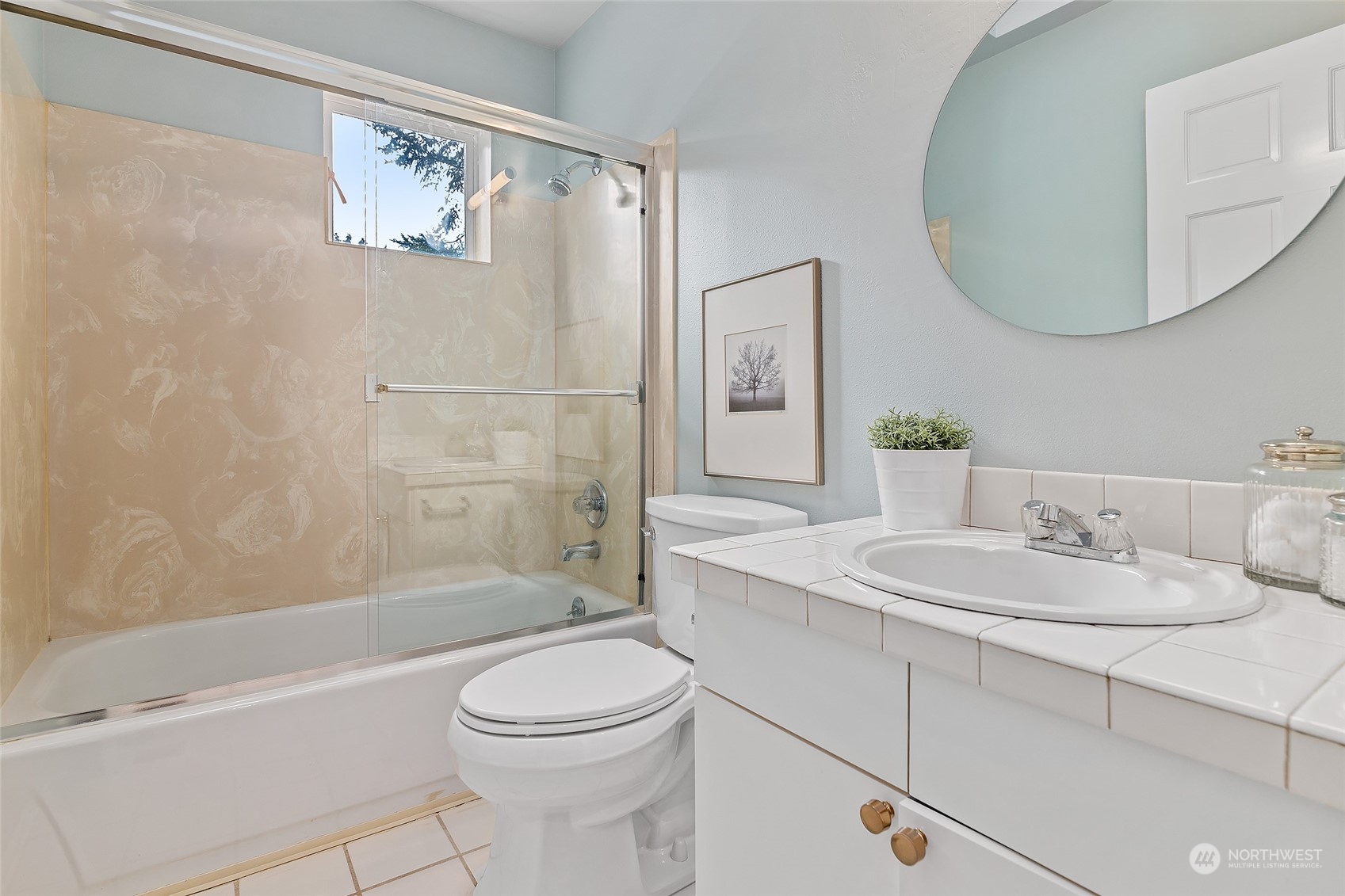 16910 3rd Avenue Southeast Bothell, WA 98012 - Photo 23 of 40 a bathroom with a sink a toilet and shower