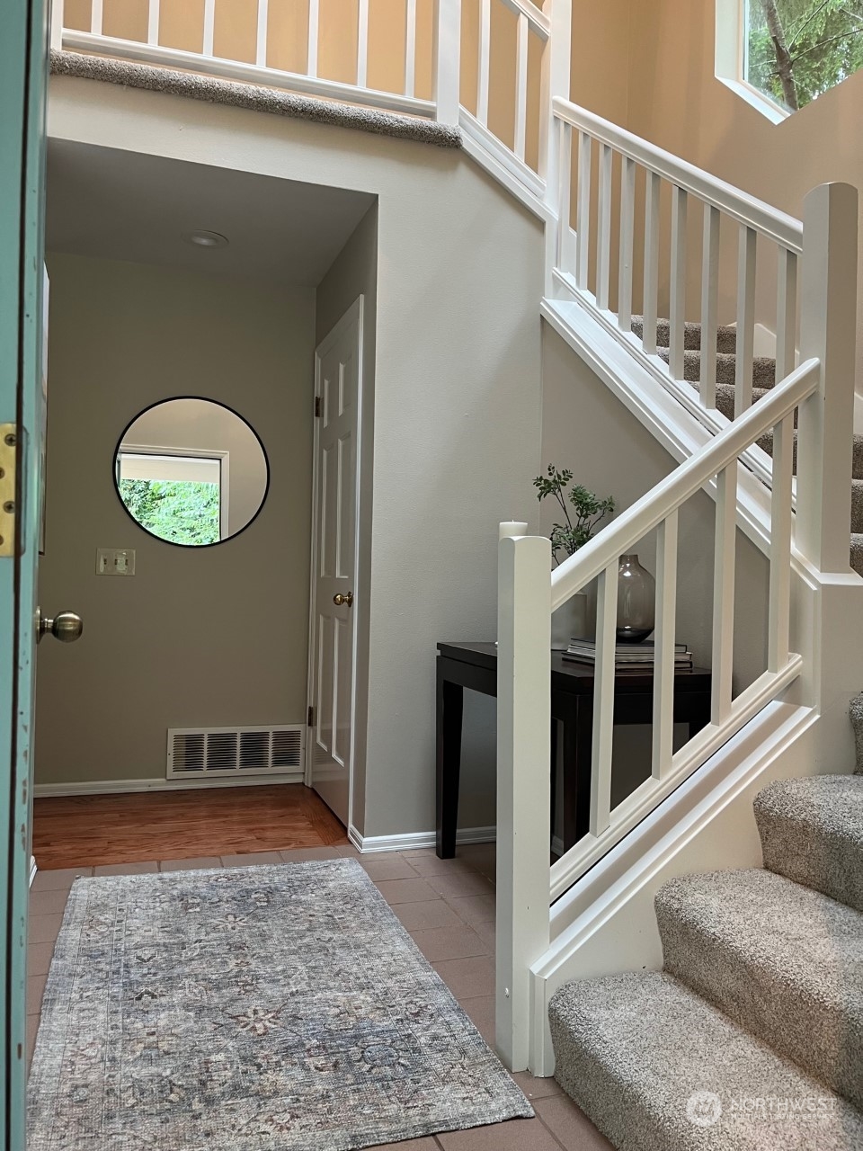 16910 3rd Avenue Southeast Bothell, WA 98012 - Photo 3 of 40 a view of a hallway with wooden floor and a large window