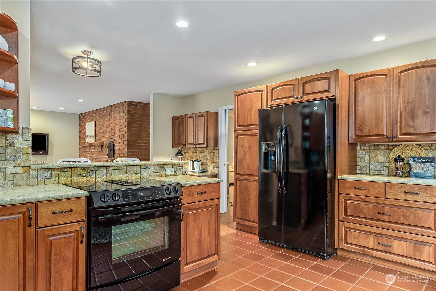 16910 3rd Avenue Southeast Bothell, WA 98012 - Photo 9 of 40 a kitchen with stainless steel appliances granite countertop a refrigerator and a stove