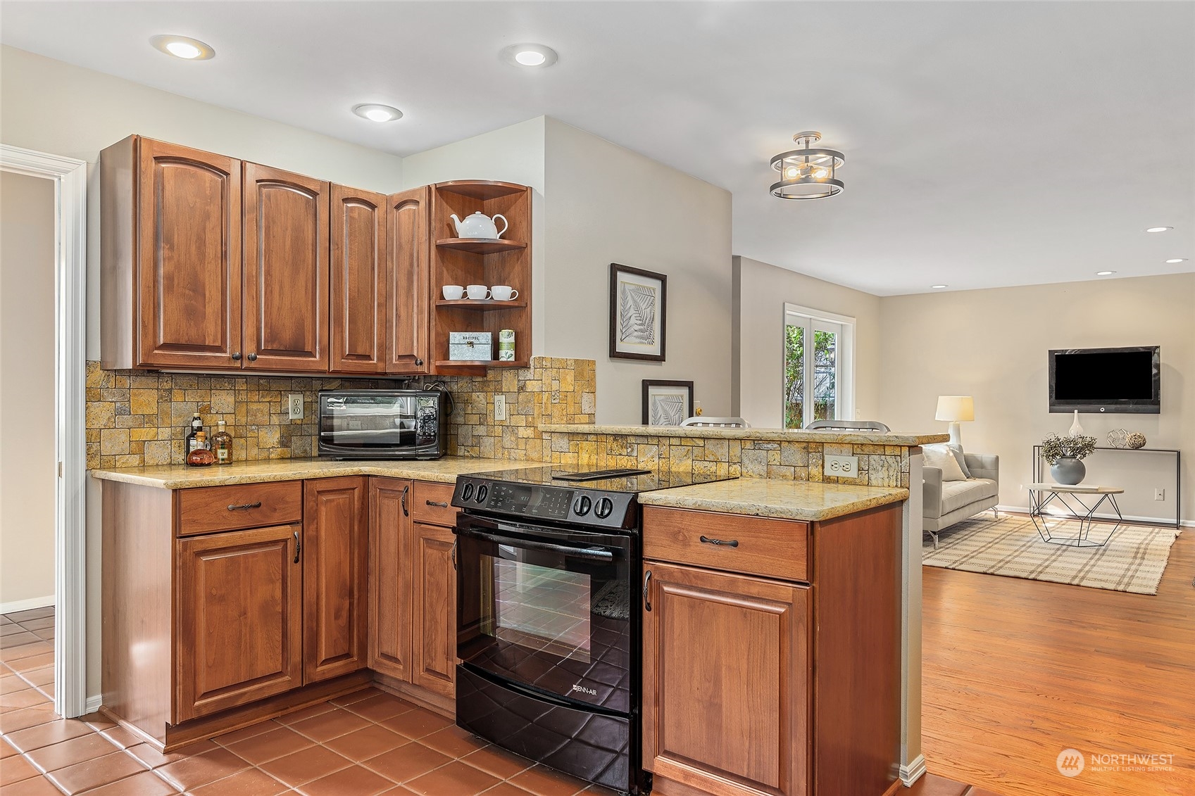 16910 3rd Avenue Southeast Bothell, WA 98012 - Photo 10 of 40 a kitchen with stainless steel appliances granite countertop a stove a sink and a microwave