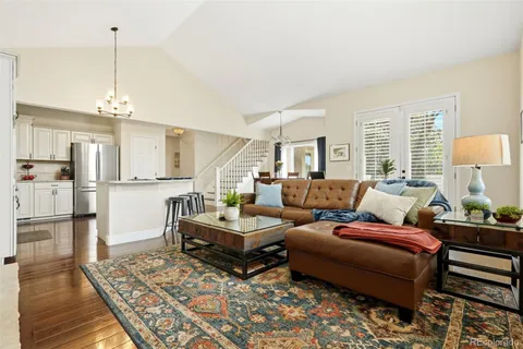a living room with furniture and a table