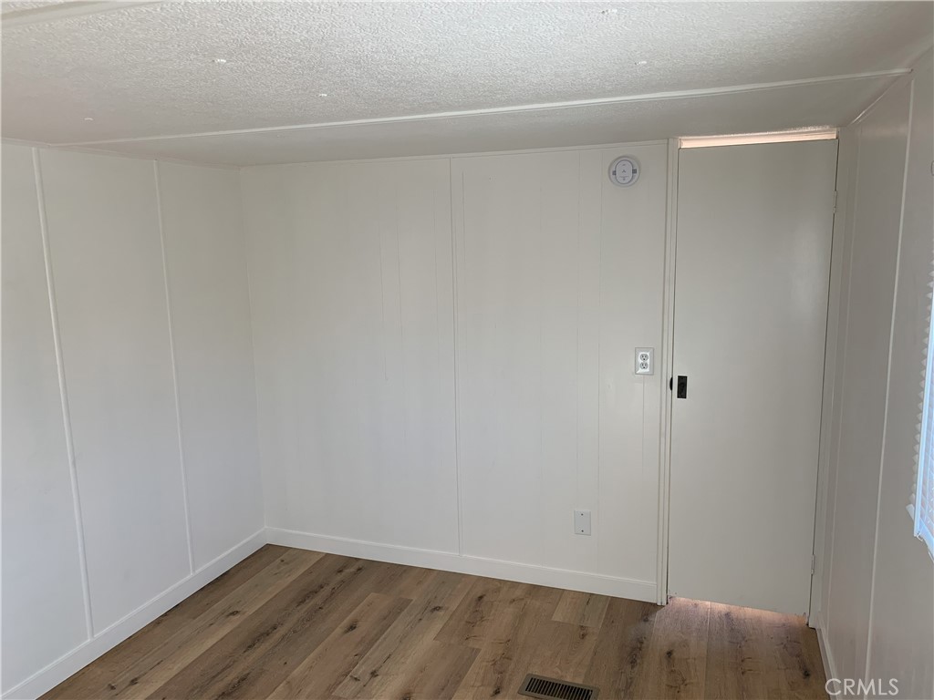 5925 Riverside Drive, Unit 12 Chino, CA 91710 - Photo 16 of 16 a view of small space with wooden floor