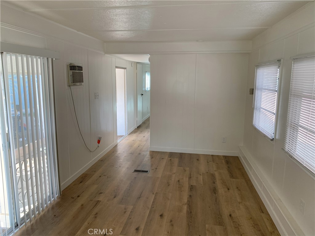 5925 Riverside Drive, Unit 12 Chino, CA 91710 - Photo 6 of 16 a view of a hallway with wooden floor and staircase