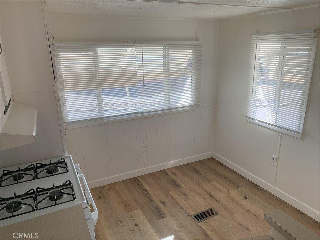 5925 Riverside Drive, Unit 12 Chino, CA 91710 - Photo 9 of 16 a view of a room with wooden floor and a window