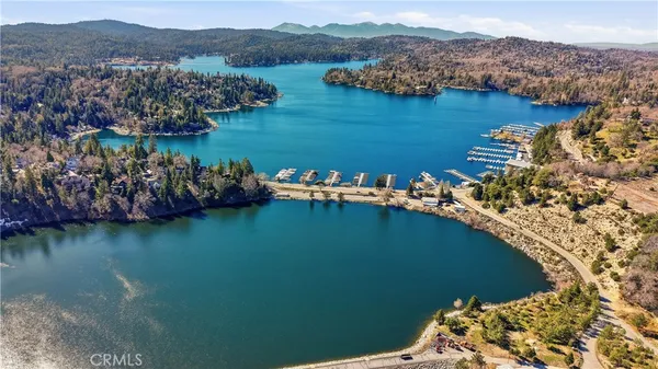 an aerial view of a houses with a lake view