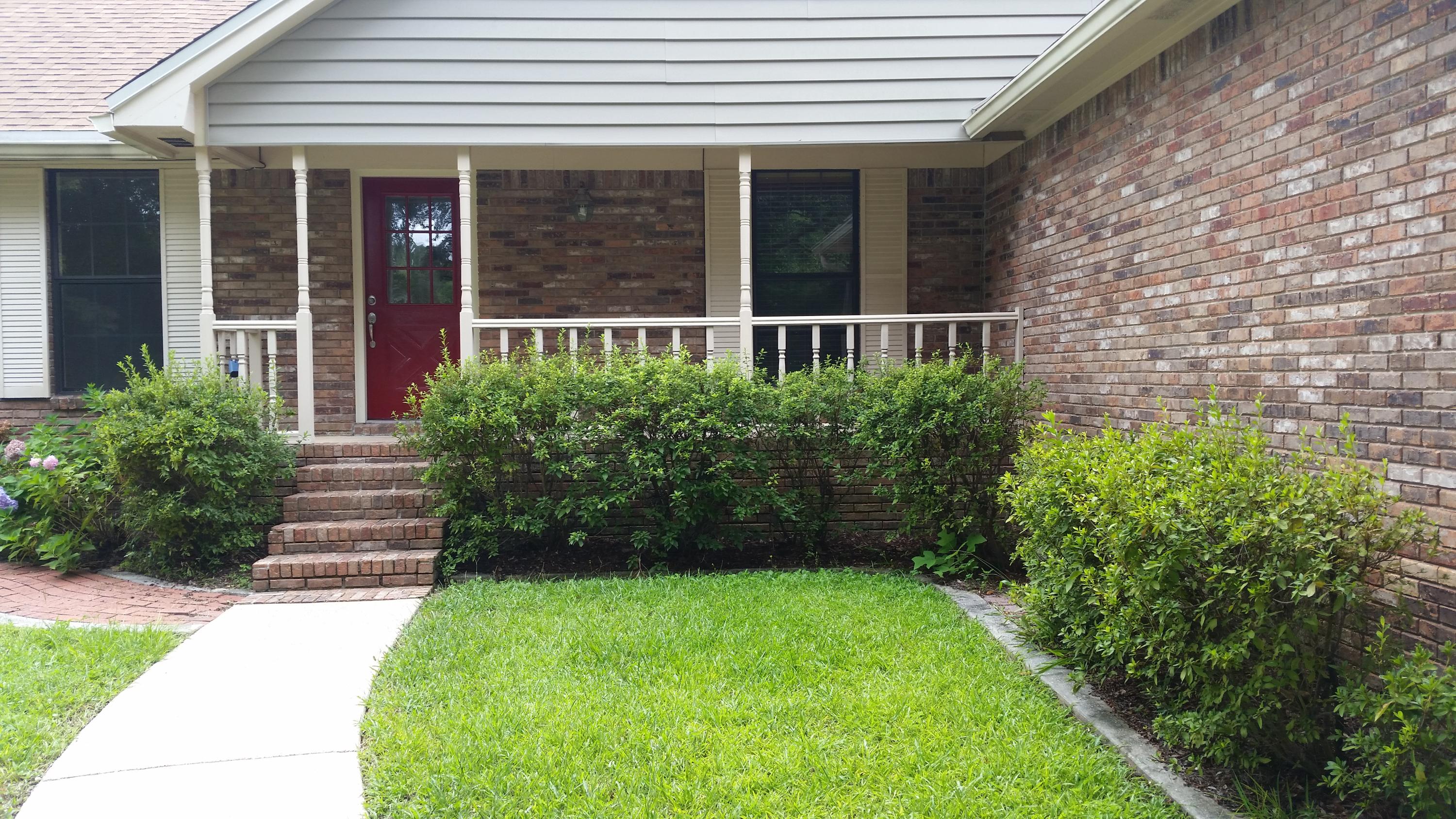 a view of house with stairs and garden