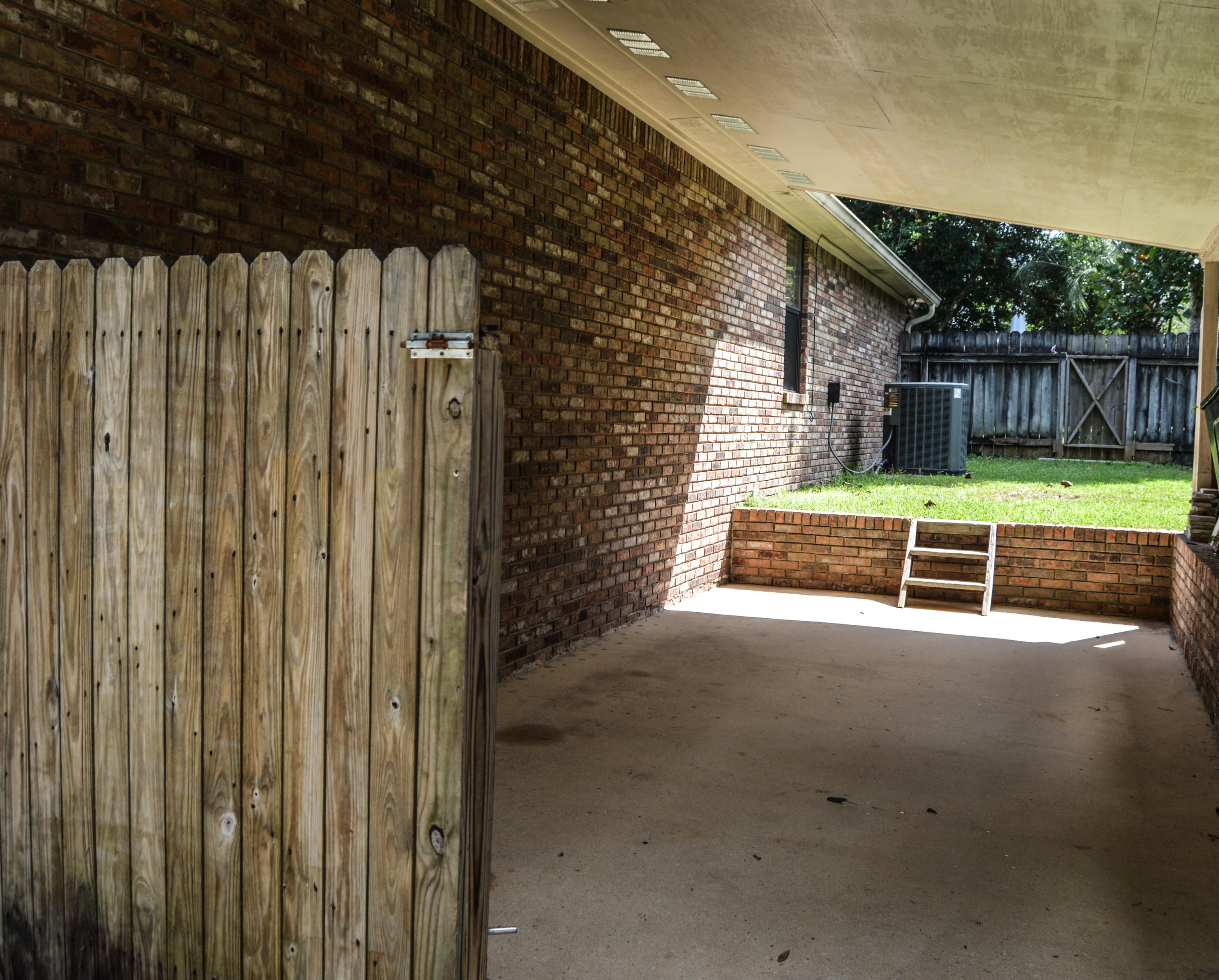 319 Ruckel Drive Niceville, FL 32578 - Photo 12 of 27 a view of a backyard with wooden fence