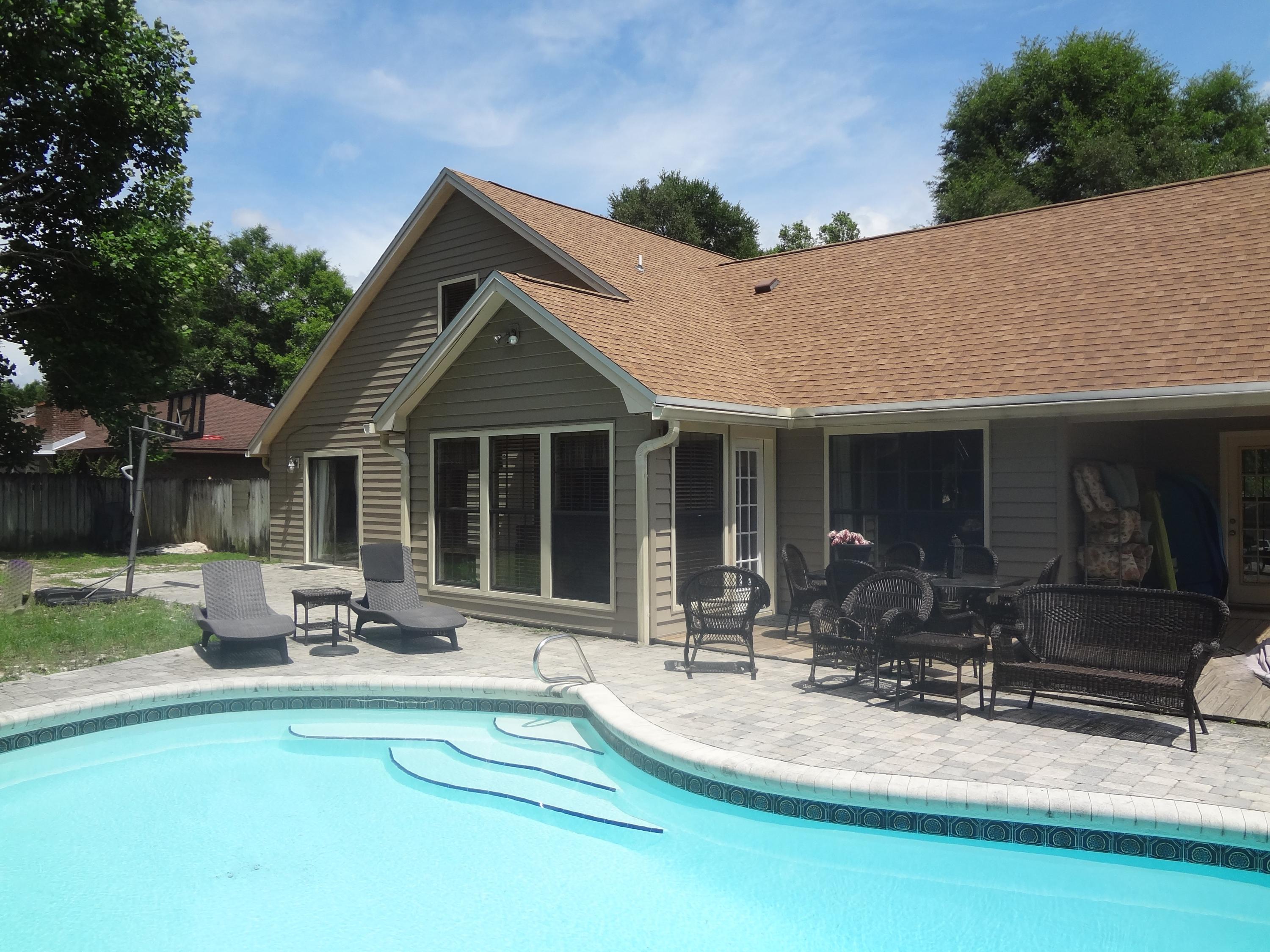 319 Ruckel Drive Niceville, FL 32578 - Photo 3 of 27 a front view of house with yard outdoor seating and barbeque oven