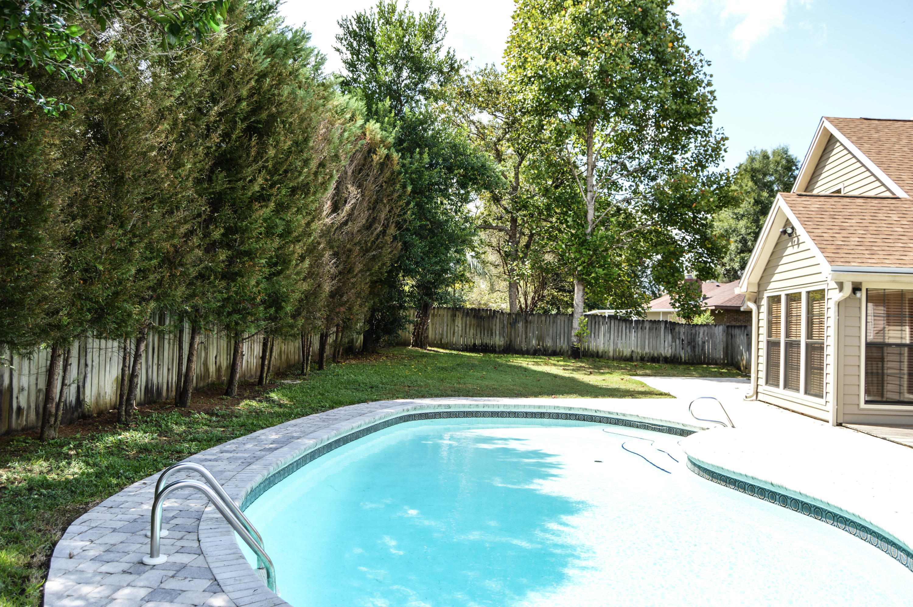 319 Ruckel Drive Niceville, FL 32578 - Photo 5 of 27 a view of a swimming pool with a backyard