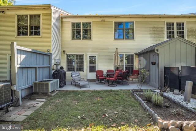 a view of a house with sitting area and furniture