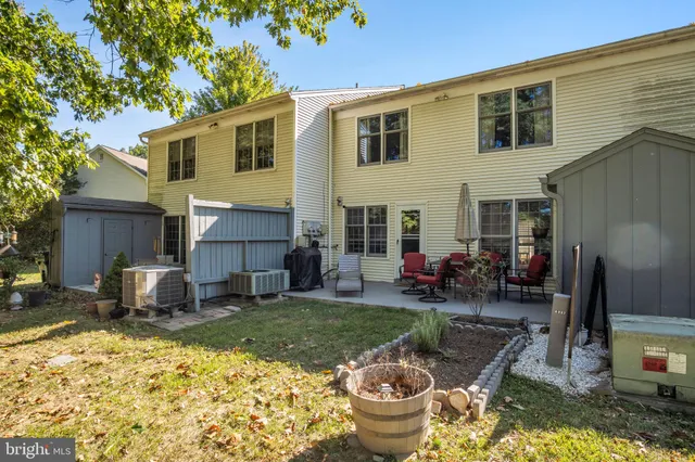 a backyard of a house with seating space