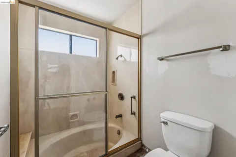 a view of an empty room and closet