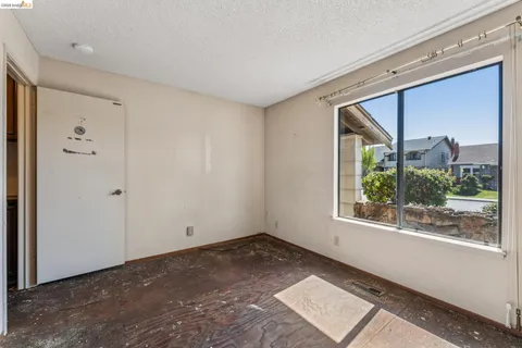 a view of a house with backyard and trees