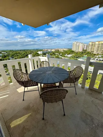 a view of a chairs and table in patio