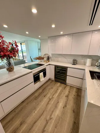 a kitchen with a sink and cabinets