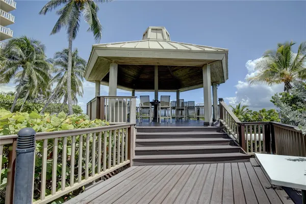a view of a wooden deck with a yard