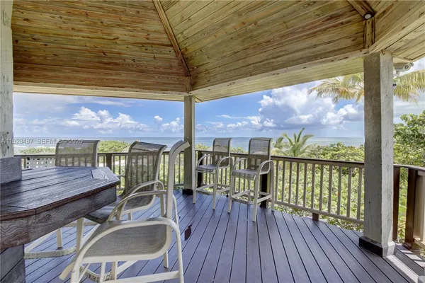 a view of a balcony with wooden floor