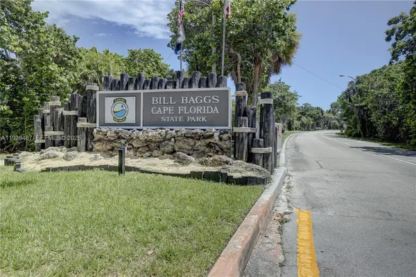 a view of a park that has large trees