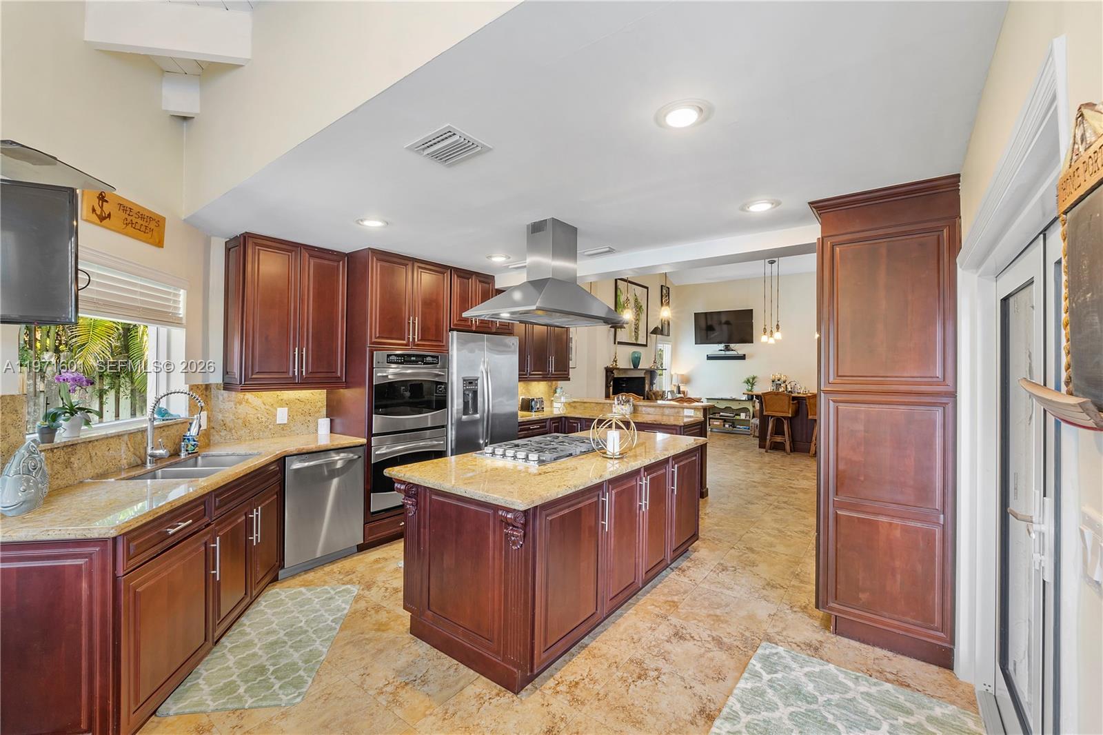 17640 Old Cutler Road Palmetto Bay, FL 33157 - Photo 14 of 56 a kitchen with stainless steel appliances granite countertop a stove a sink dishwasher a refrigerator and a oven