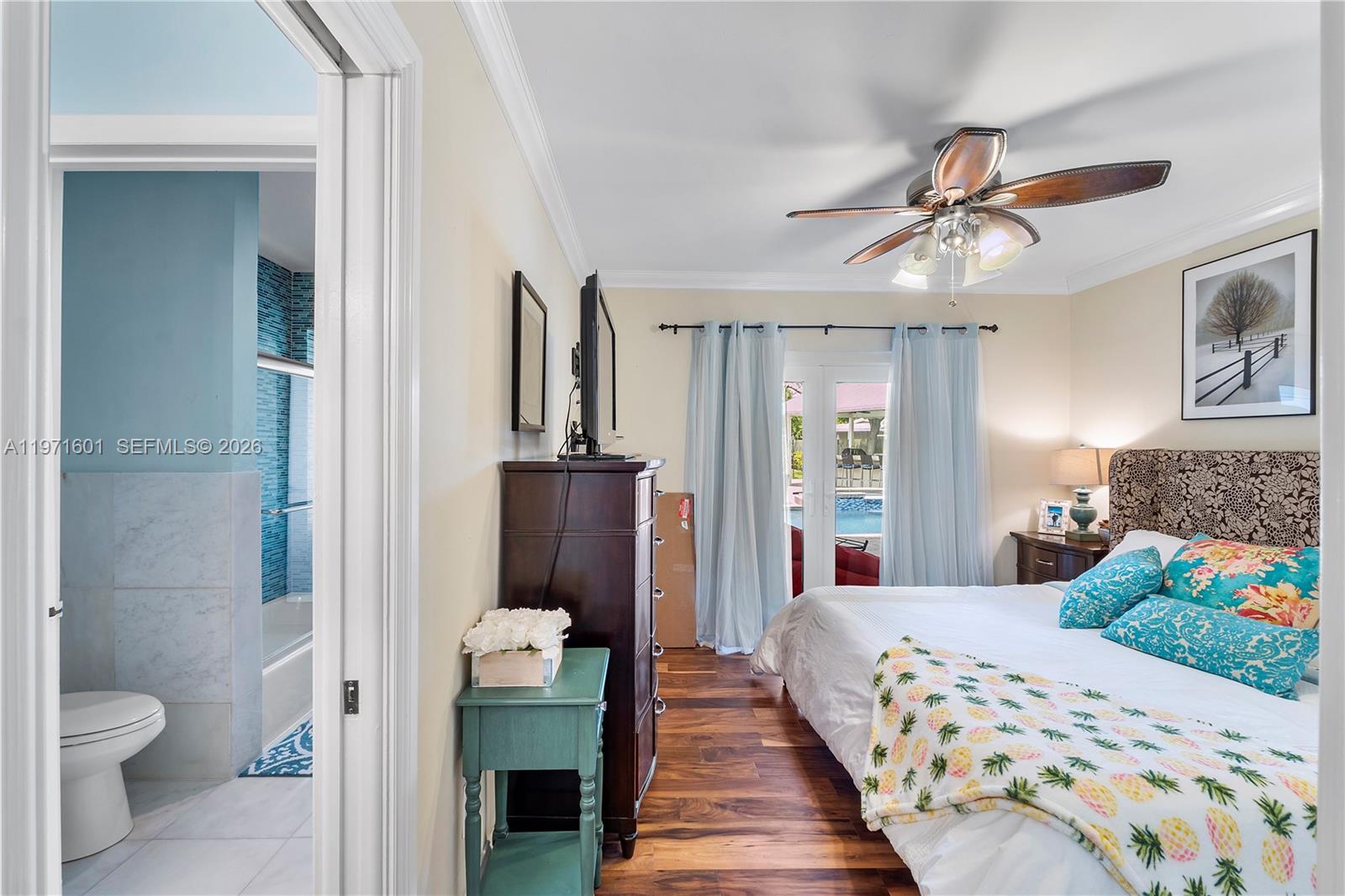 17640 Old Cutler Road Palmetto Bay, FL 33157 - Photo 19 of 56 a bedroom with a bed and a view of bathroom
