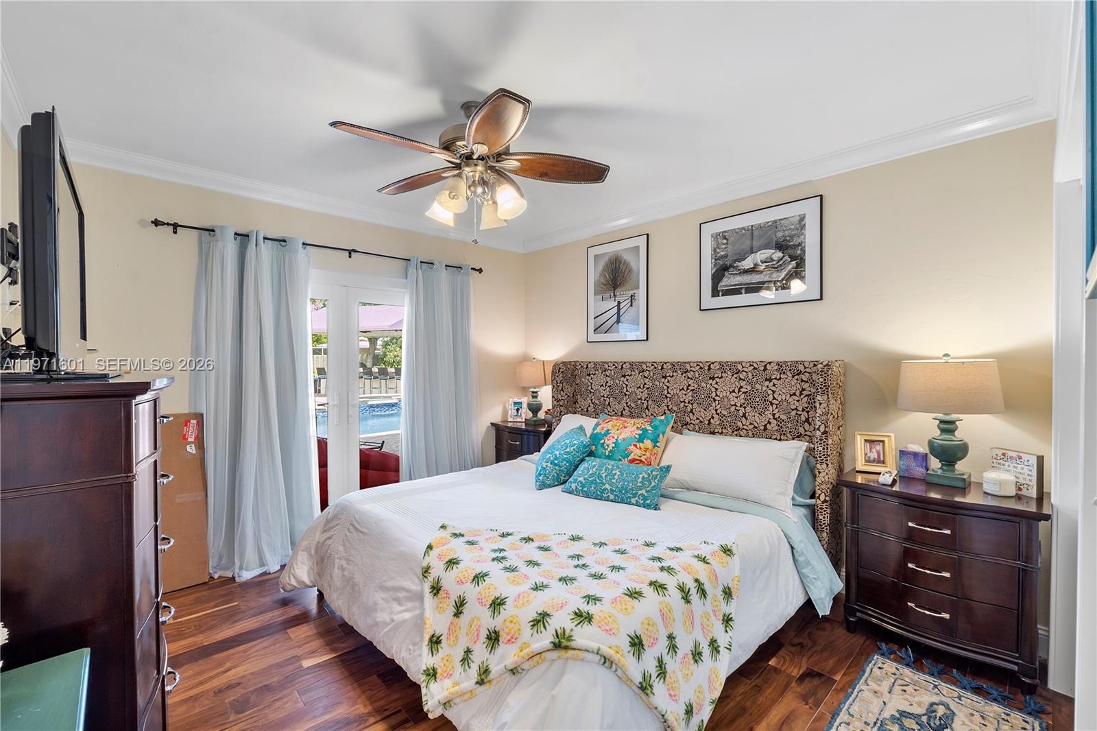 17640 Old Cutler Road Palmetto Bay, FL 33157 - Photo 20 of 56 a bedroom with a bed and wooden floor