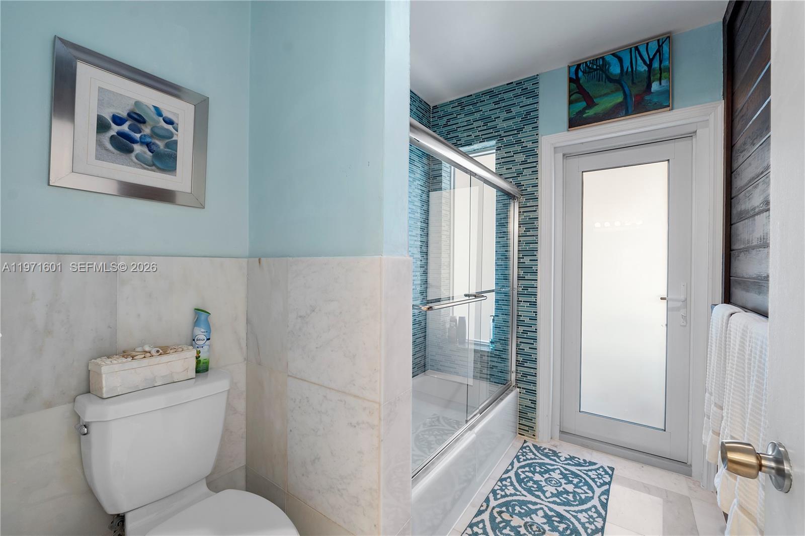 17640 Old Cutler Road Palmetto Bay, FL 33157 - Photo 22 of 56 a bathroom with a toilet and a shower