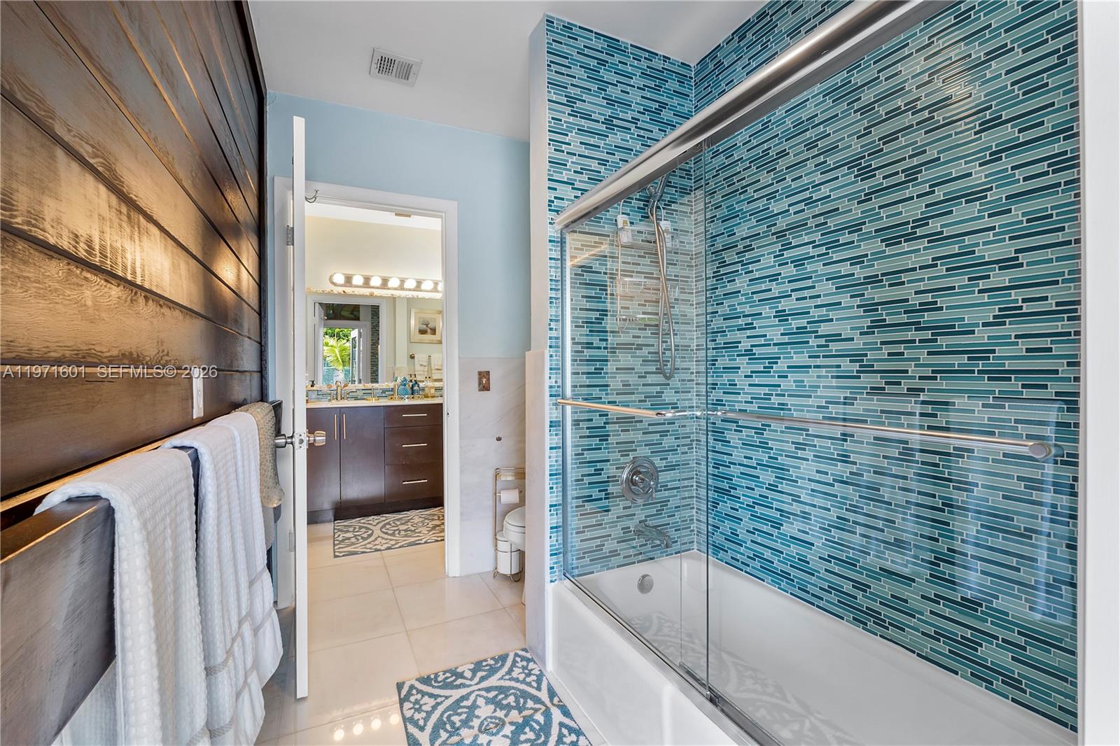 17640 Old Cutler Road Palmetto Bay, FL 33157 - Photo 23 of 56 a bathroom with a bathtub and shower