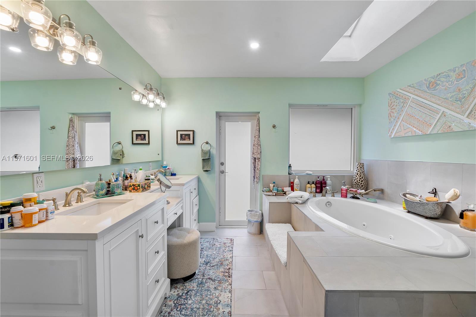 17640 Old Cutler Road Palmetto Bay, FL 33157 - Photo 32 of 56 a room with a white cabinets and chandelier